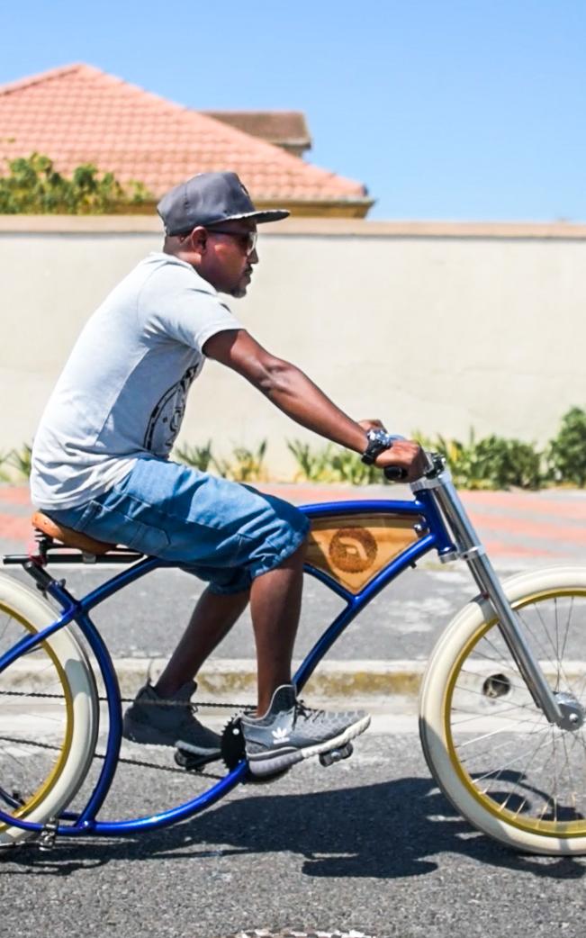 man riding vintage bicycle