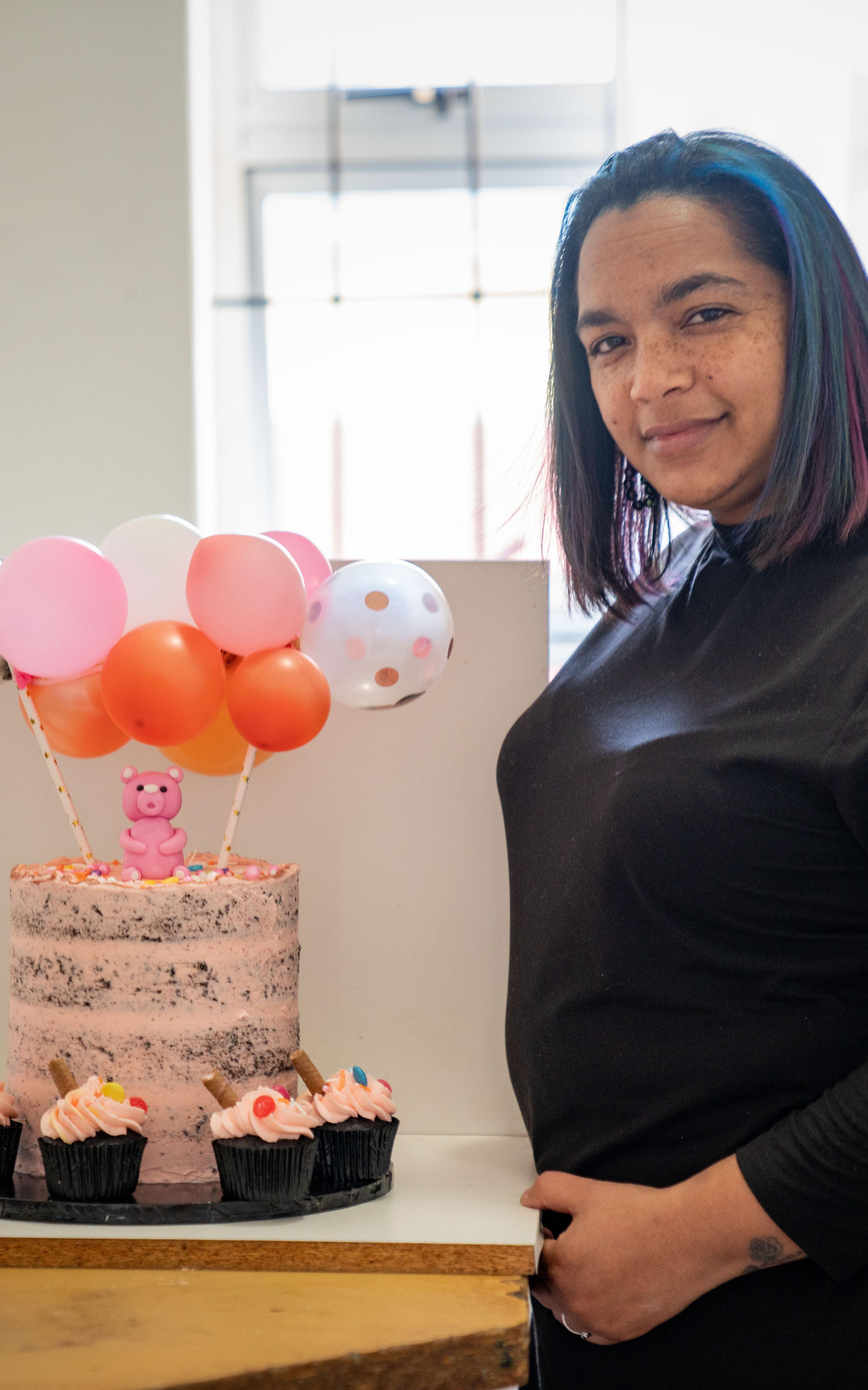 Beautiful News - Shaundre Lottering of Taste of Heaven standing beside one of her cake creations