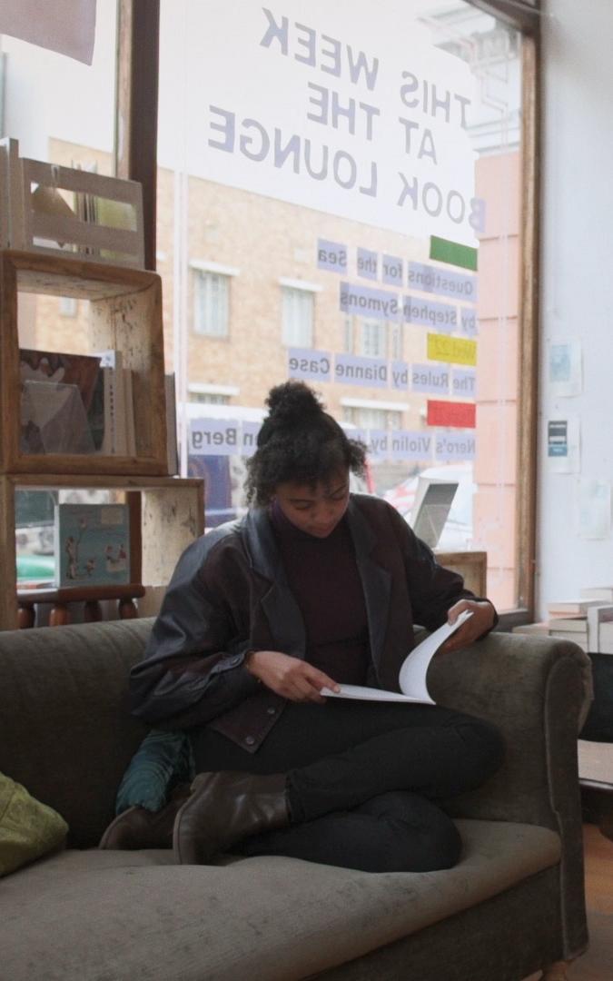 Young girl reading a book.