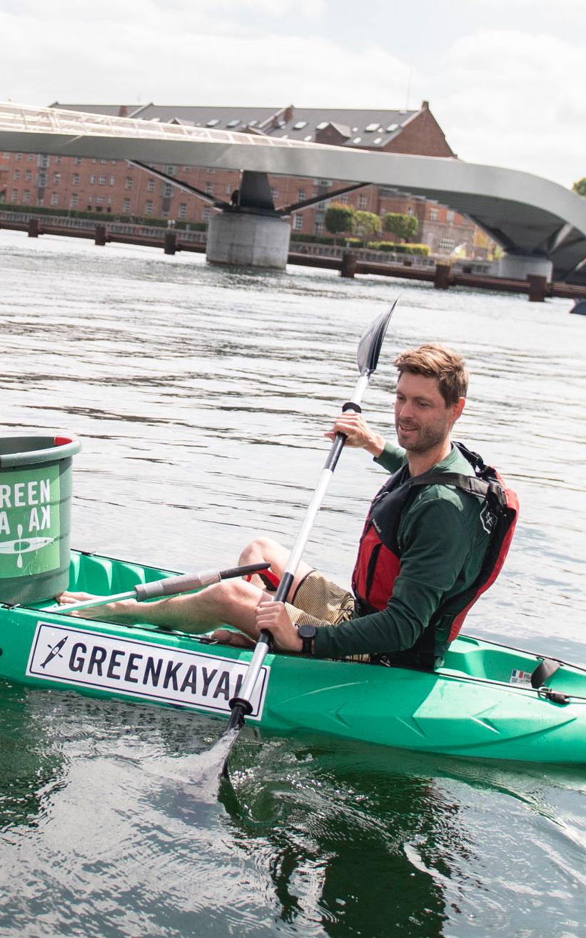 Beautiful News-Two men in a green kayak