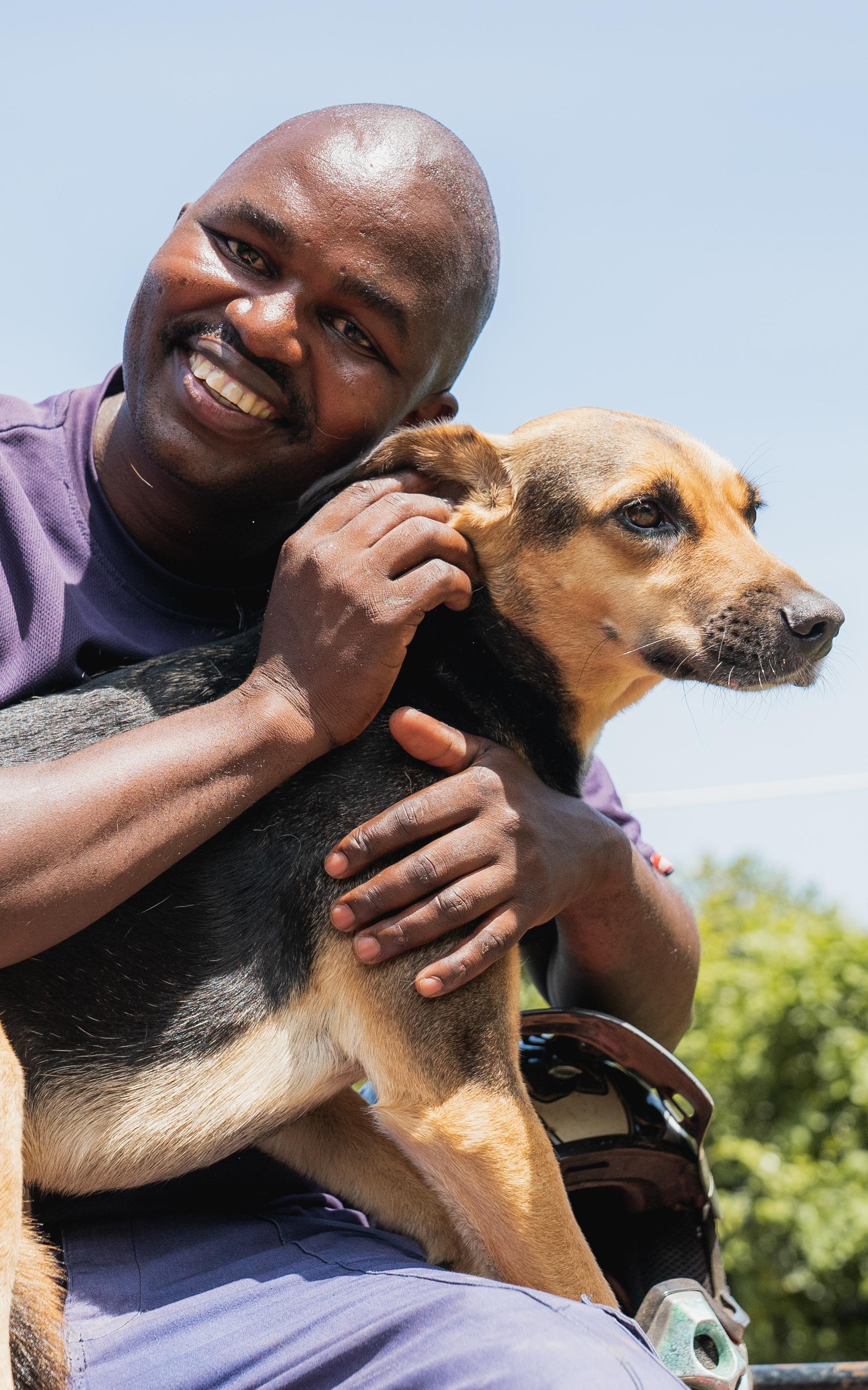 Man hugging dog