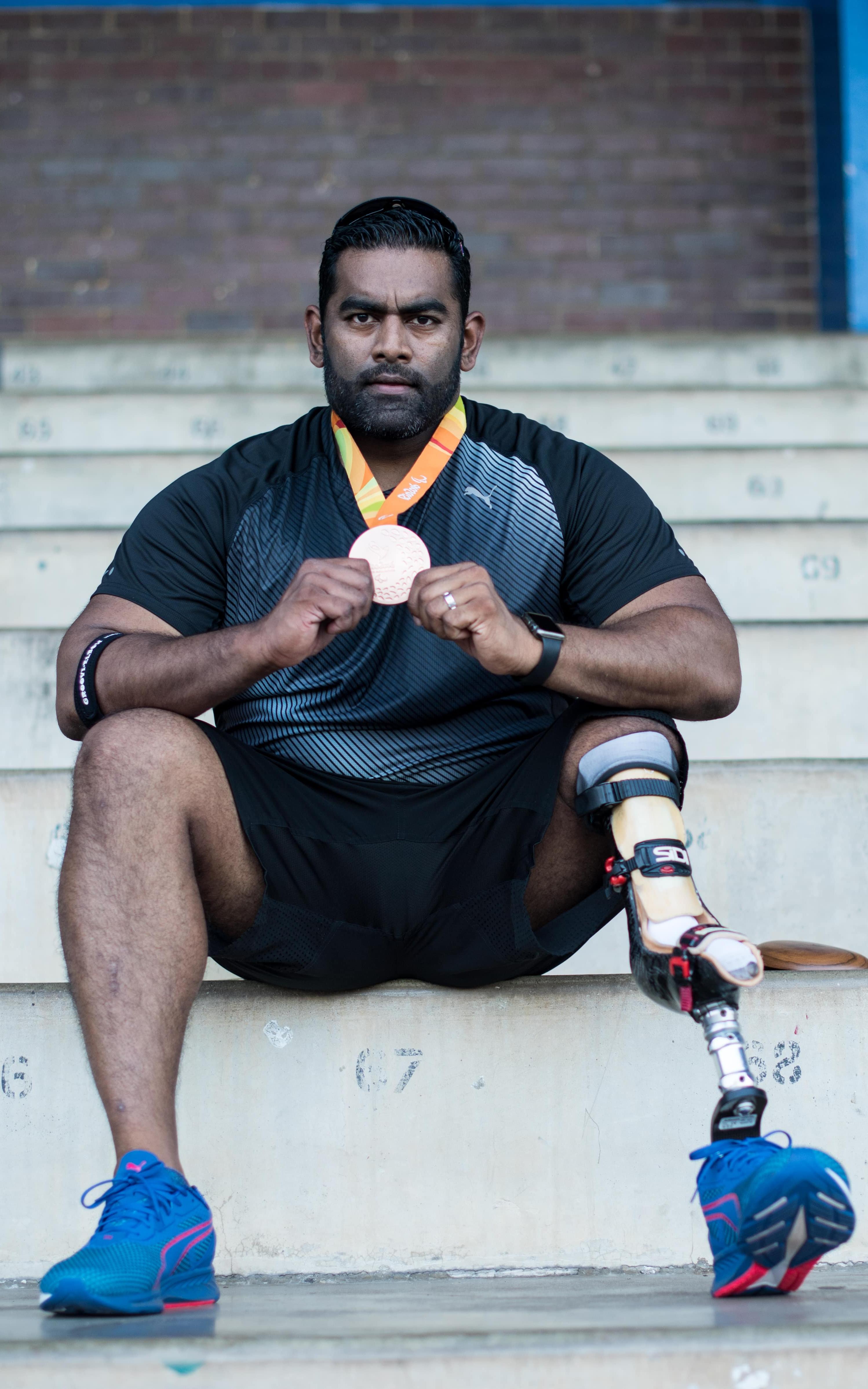 Paralympian holding medal