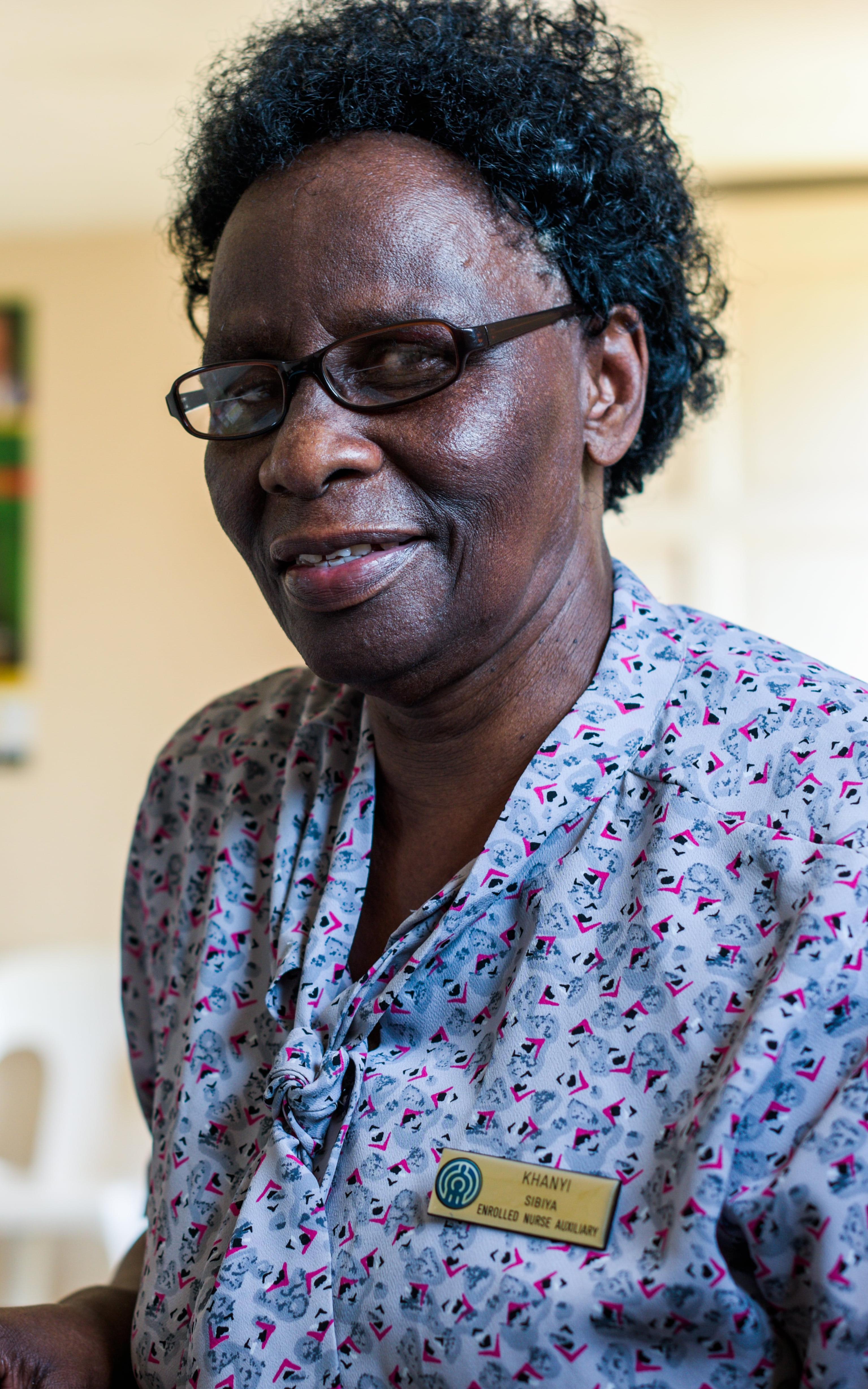 Black nurse smiling at the camera