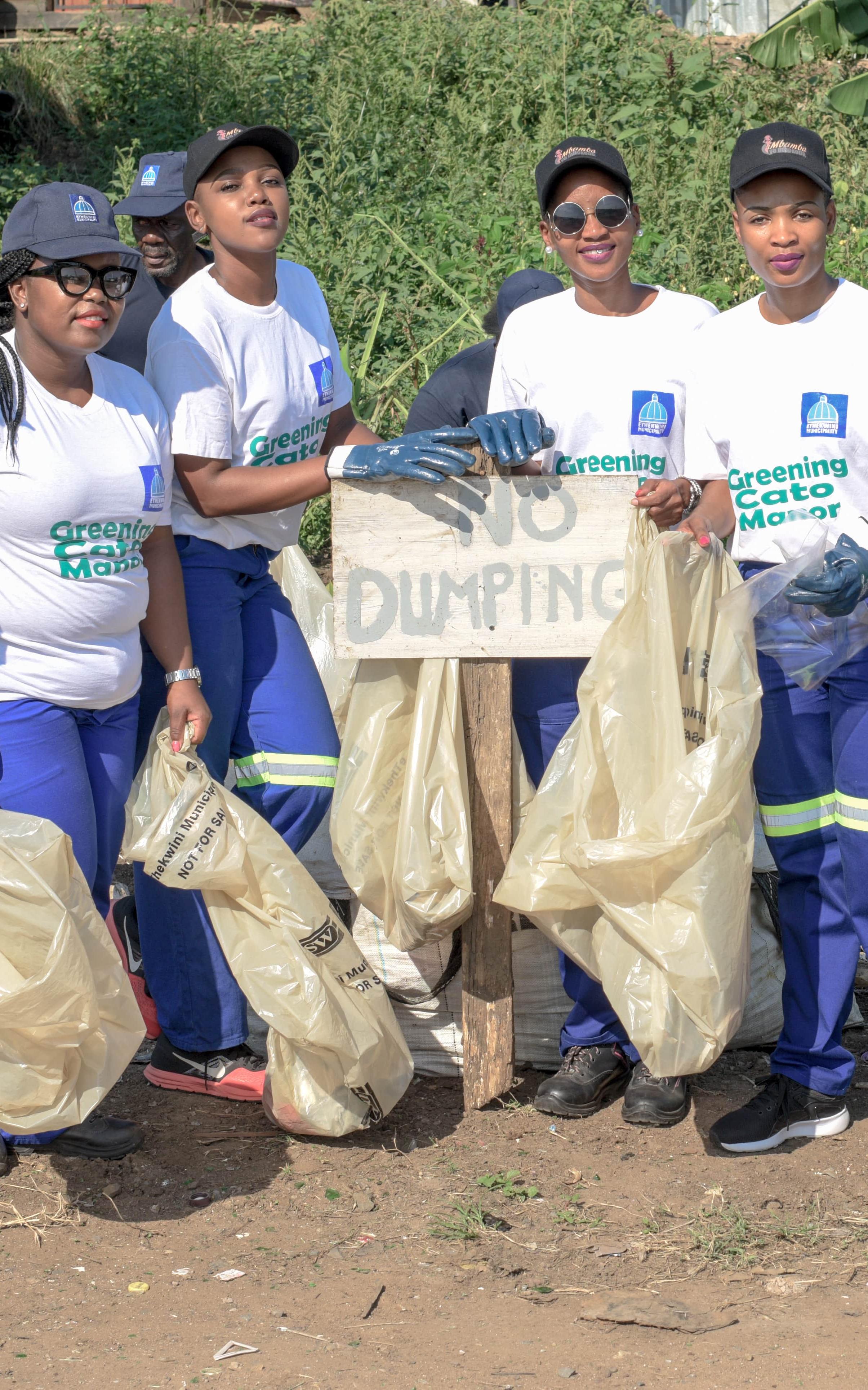 Group of black woman in cleaning outfits.