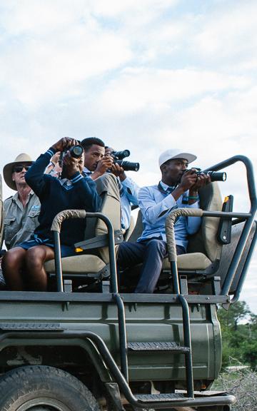 Kids taking photos on safari