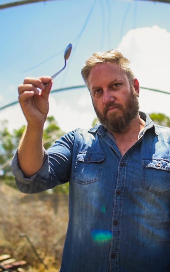 Man holding bended spoon