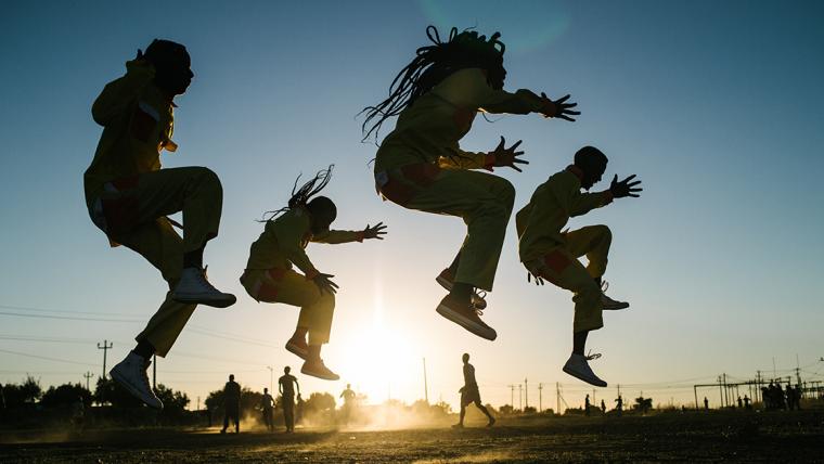 Pantsula dancers in sunset