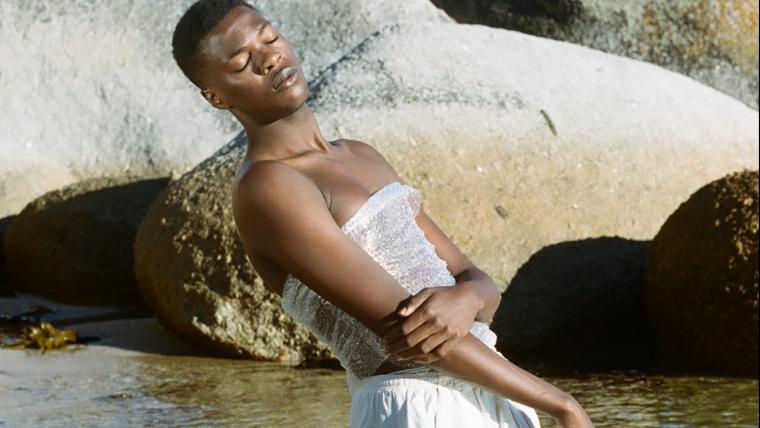 Man wearing plastic and standing in water