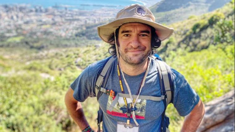 Man with climbing gear.