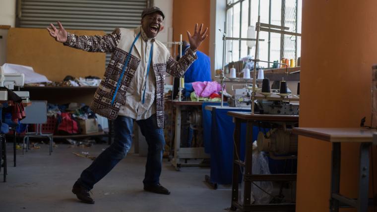 Man dancing in his studio.