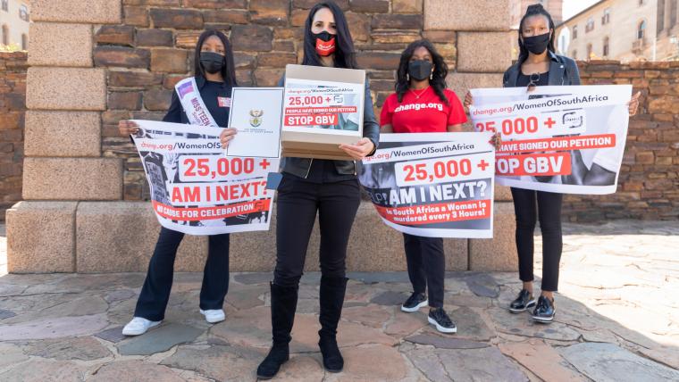 Beautiful News-Women holding protest banners. 