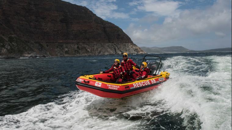 People on a rescue boat in the water