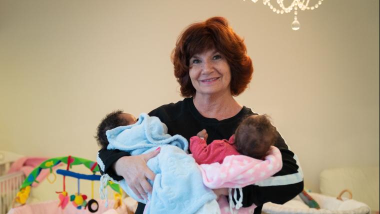 A trained safety mother taking care of abandoned infants.