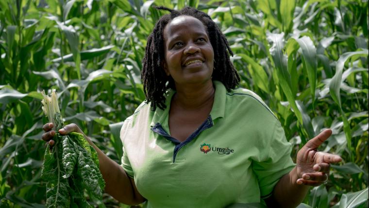 woman smiling in field of crops