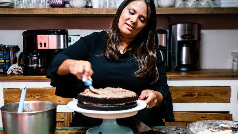 Woman icing a cake