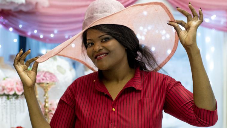 Woman posing with hat