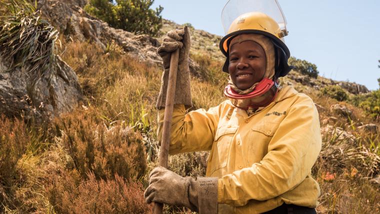 Woman firefighter smiling to camera