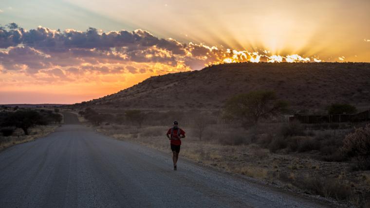 Man running during sunset