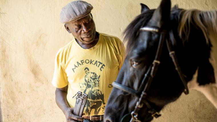Black man with a horse