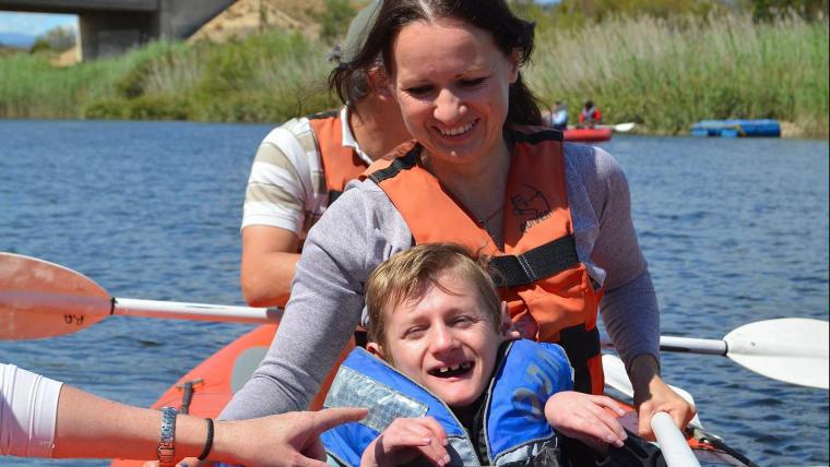 Mother and son in raft.