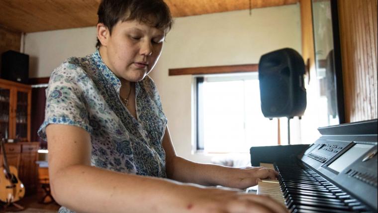 Blind woman playing piano