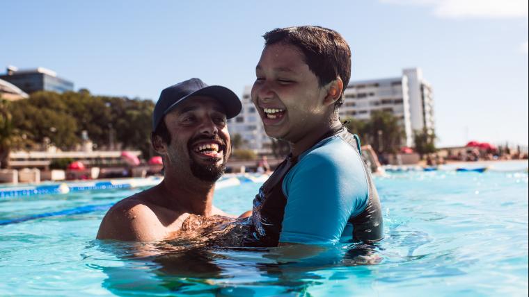 Dad and son in swimming pool