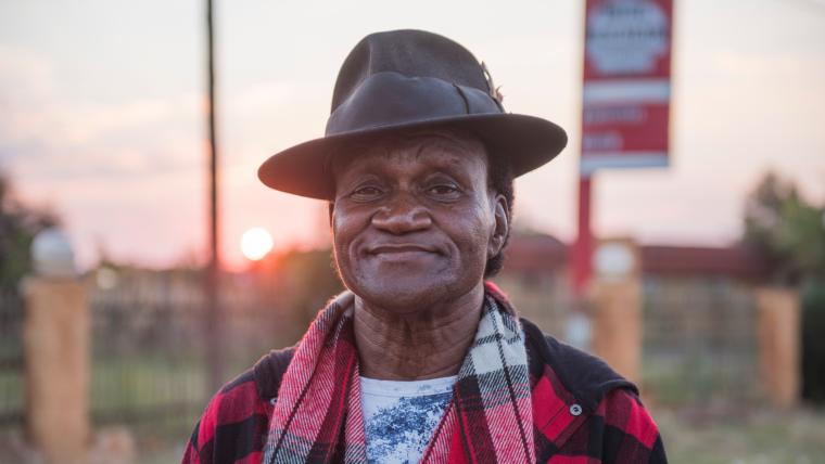 Black man wearing a hat