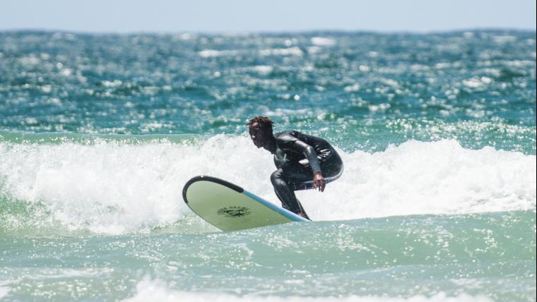 The surfer rising from rock bottom to ride the waves of his full potential