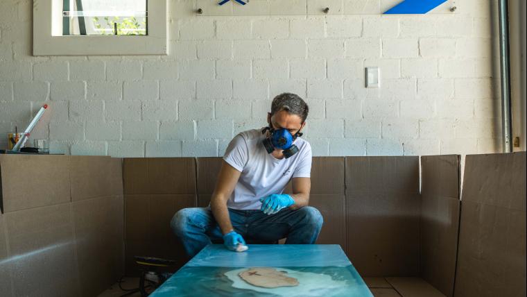 Man painting a canvas