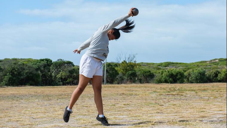 Girl playing shot put