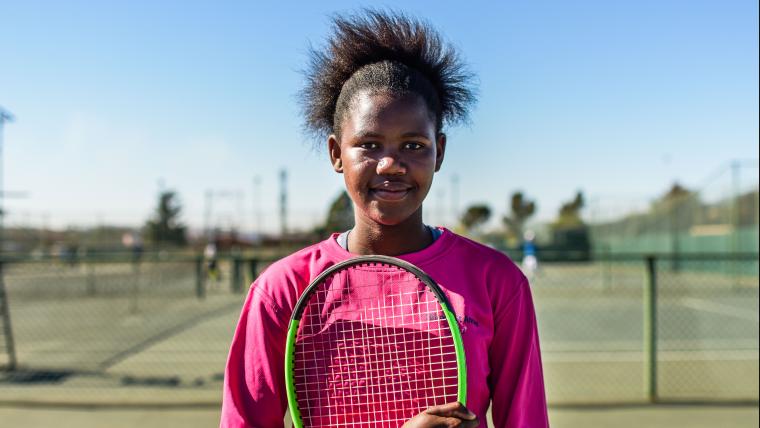 Girl holding tennis racket
