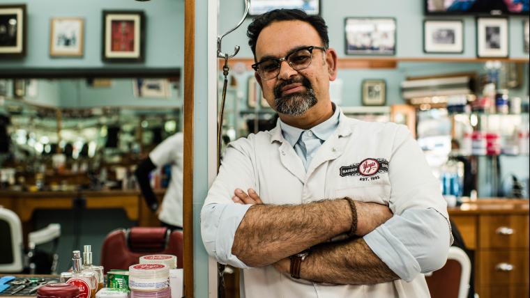 Barber smiling in his shop