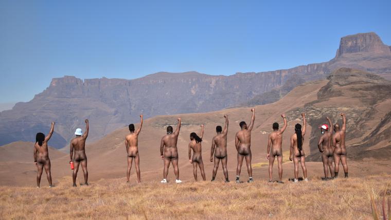 Beautiful News-Nude men on a hike facing away from camera.