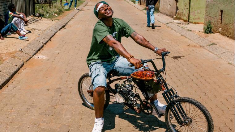 Man on motorised bicycle