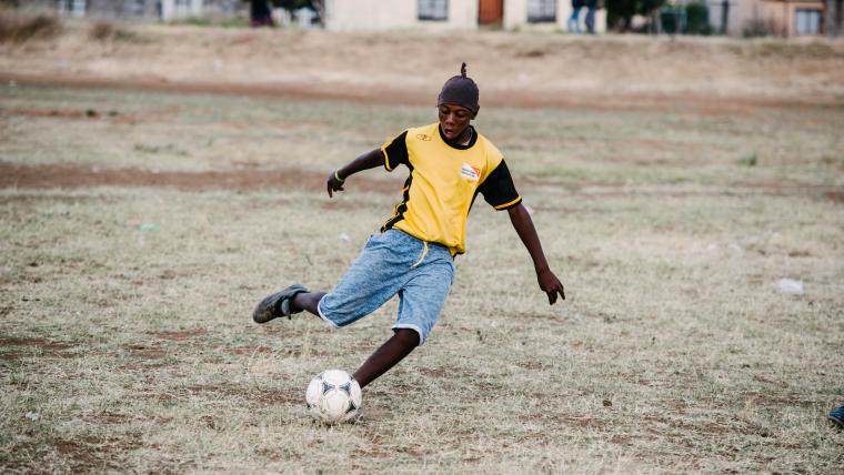 Kid playing soccer