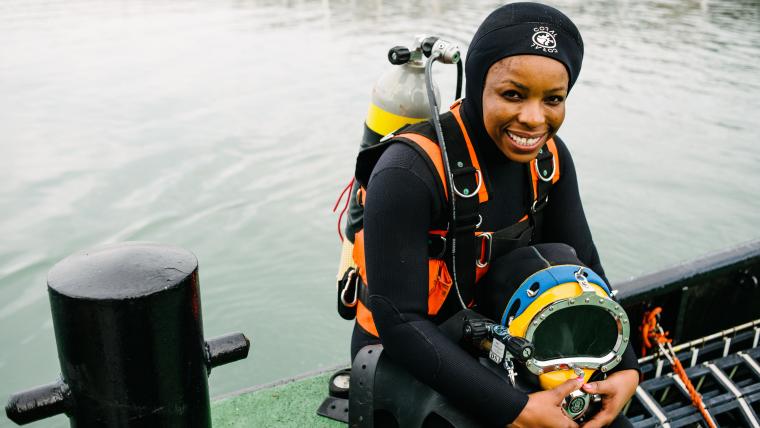 Woman in scuba gear.