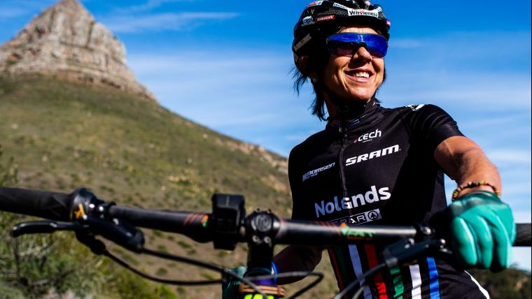 Woman posing with mountain bike