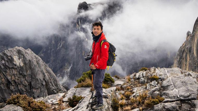 Beautiful News- Young man hiking a mountain range