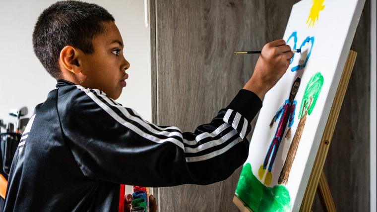 A boy with autism using art as form of expression and release.