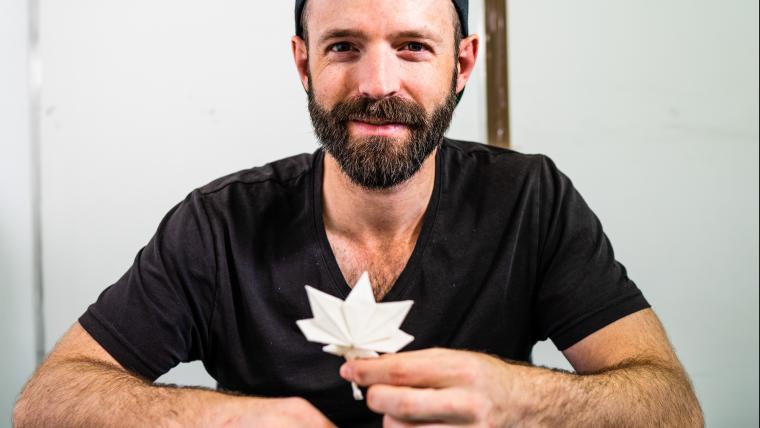 Man posing with origami