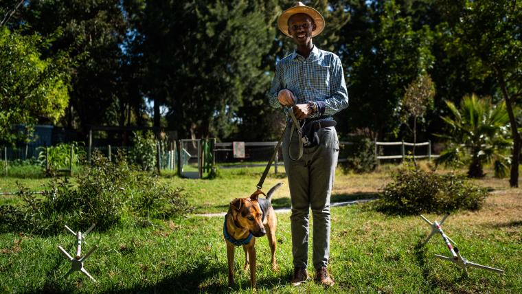 Boy with dog on lead. 