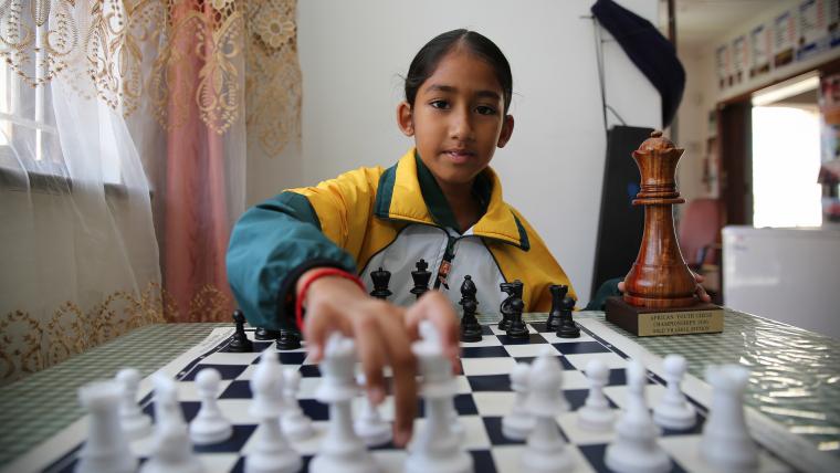 Girl playing chess