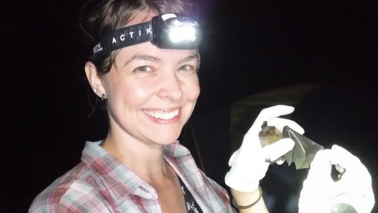 Beautiful News-Woman holding a bat.