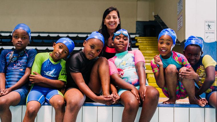 Woman with children in swimming caps
