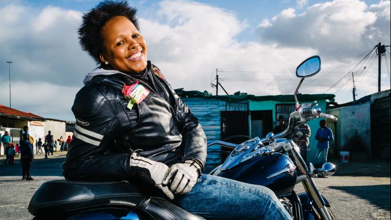 Black woman on a bike