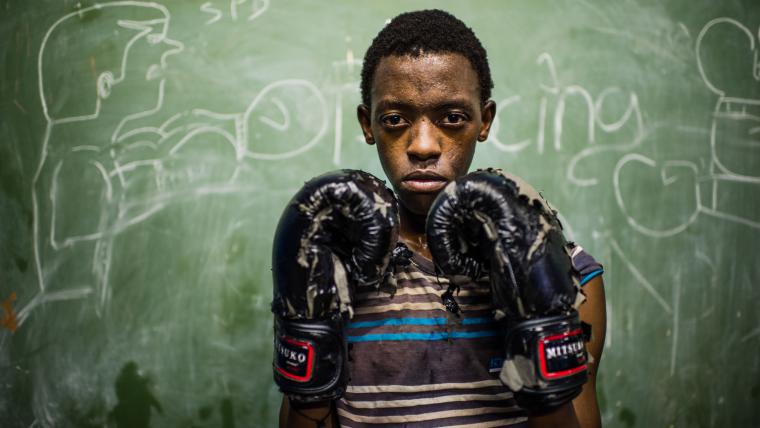 Kid in boxing gear.