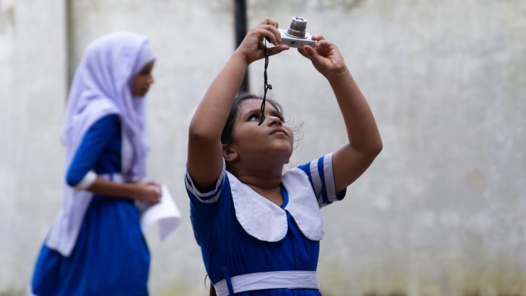 Young girl with camera.