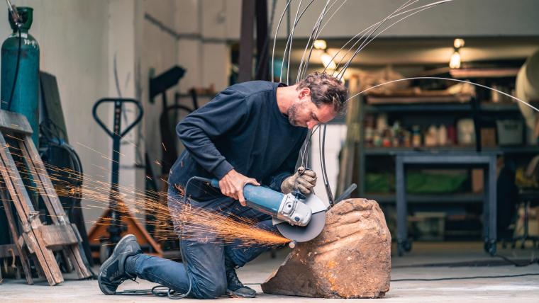 Man shaping rocks. 