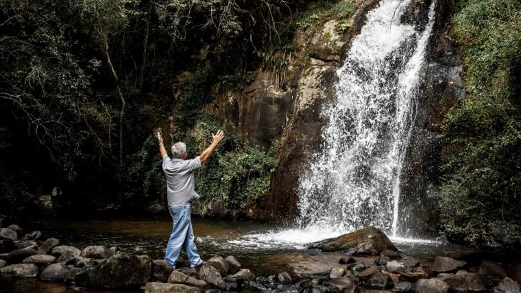 Man at waterfall