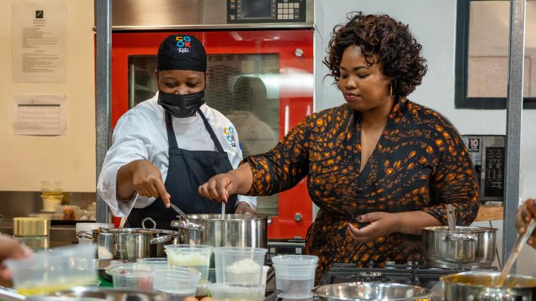 Beautiful News - Mbuyi Jongqo of COOKtastic prepares food with one of her aspiring chef students